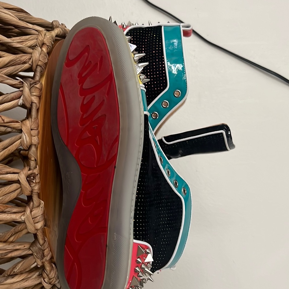 Yellow, pink, red, black, and teal Louboutin